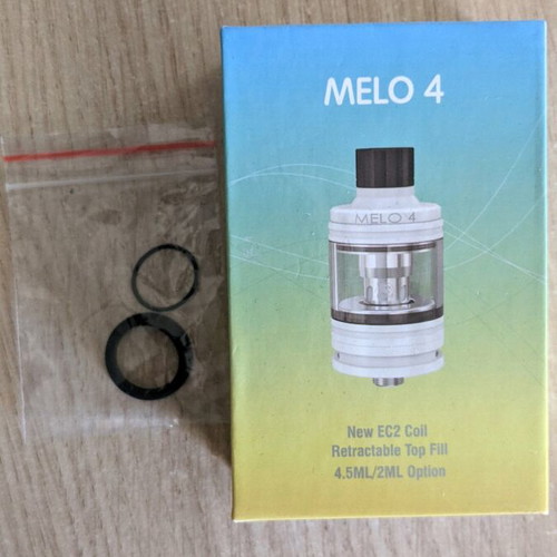 Vape device with Melo 4 head, four Eleaf atomizers and two flavor bottles like new