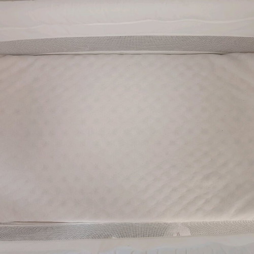 Vintage wooden baby cot with used Greco Strom mattress