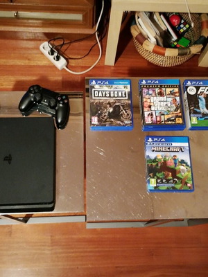 PlayStation 4 Slim 1TB like new with two DualShock controllers and 4 games