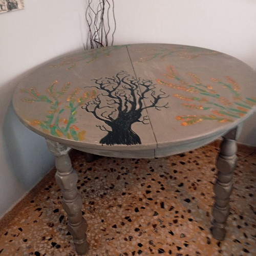 Round table with painted design, chalk paint