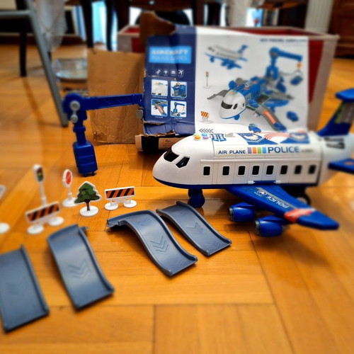 Airplane toy used with lights and sounds, transforms into station