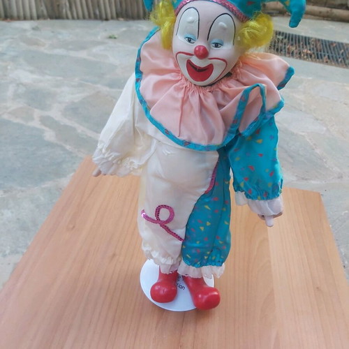 Porcelain clown doll new with stand