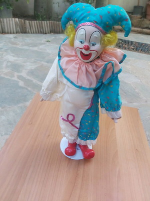 Porcelain clown doll new with stand
