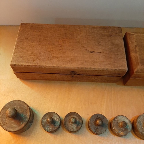 Wooden boxes with used bronze and cast iron scales set