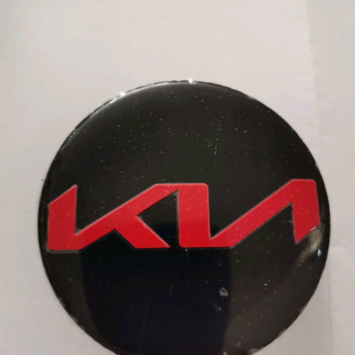 Kia 58mm wheel center caps new, black with red letters
