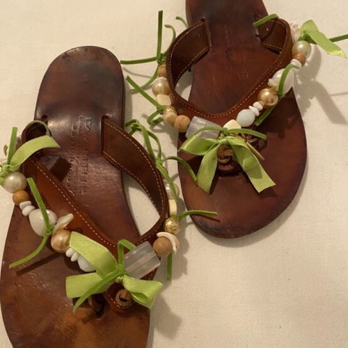Leather slippers like new, decorated with beads and green ribbons, size 36