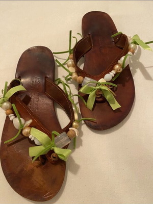 Leather slippers like new, decorated with beads and green ribbons, size 36