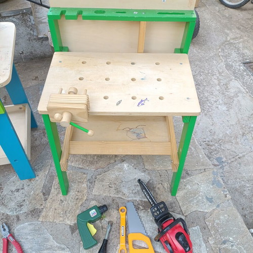 Children's wooden workbench used with tools