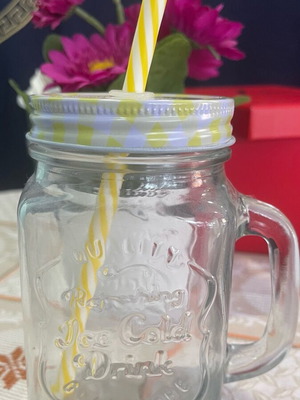 Glass with handle and yellow straw new
