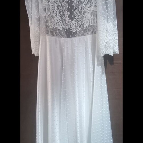 Romantic vintage-inspired wedding dress with polka dot tulle and lace