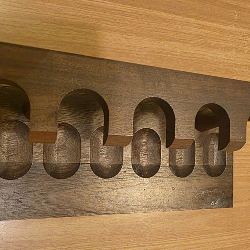 Handmade wooden pipe stand used for six