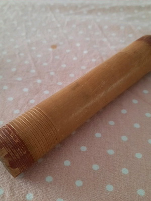 Collectible wooden weaving spool used