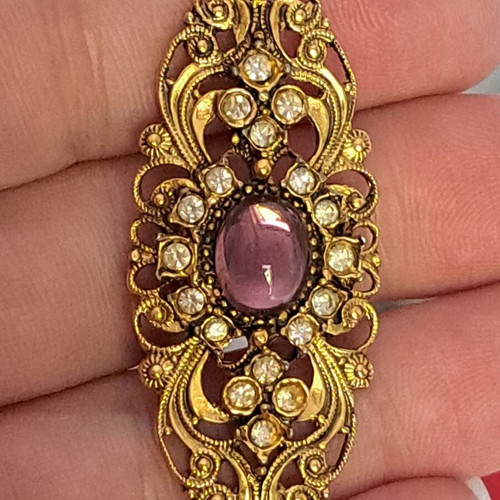 Vintage pendant motif with purple stone and white accents, like new
