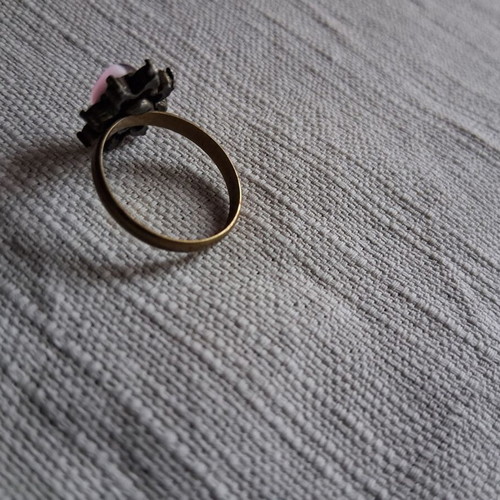 Ring used matte gold color with pink stone and rhinestones