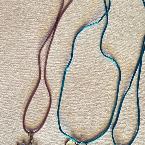 Set of handmade necklaces like new with crown, heart, and eye pendants