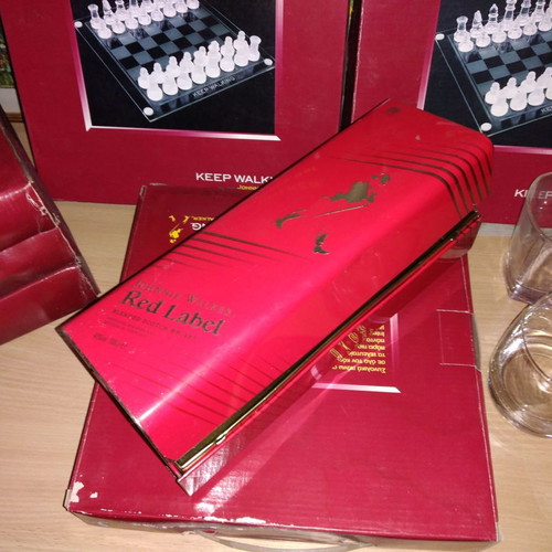 Johnnie Walker collectible set new with chess, whiskey glasses, and metal box