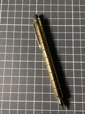 Gold Fidget Pen used with magnetic parts and two ink refills