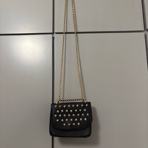 Shoulder bag with gold stars and chain like new, black