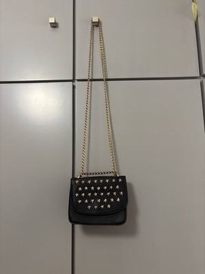 Shoulder bag with gold stars and chain like new, black