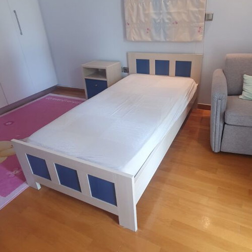 Blue bedroom set with desk, bookshelves and bed