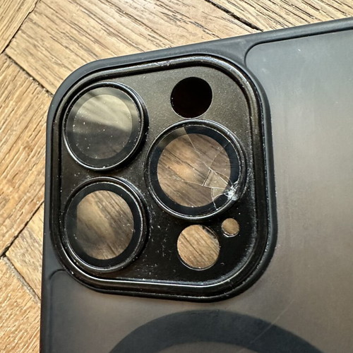 iPhone 14 Pro case with broken right lens protector