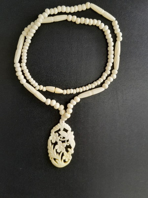 Handmade carved necklace like new