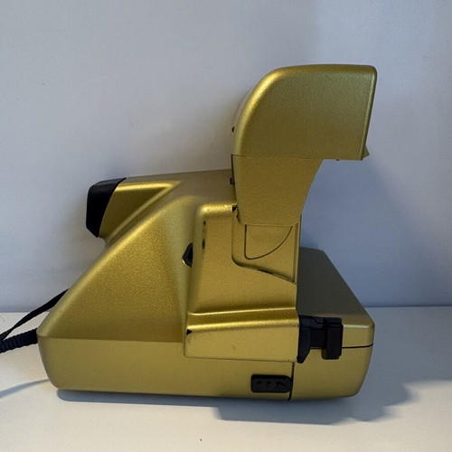 Polaroid OneStep AF camera, gold, for parts or repair