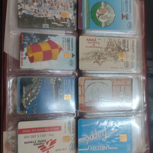 Phone cards used, album with 66 pieces