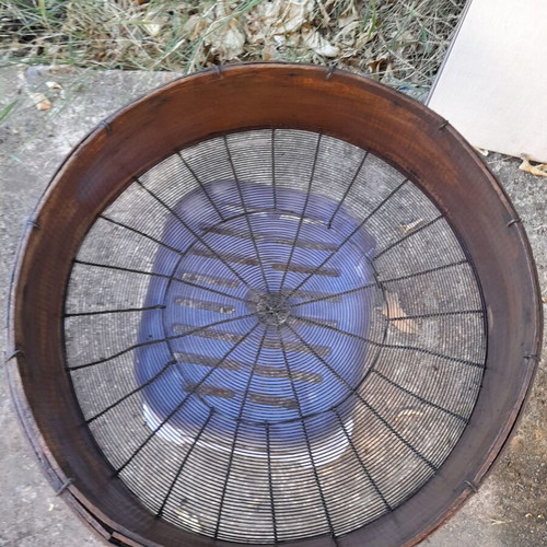 Handmade antique sieve with wooden frame and metal mesh