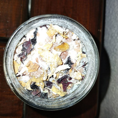 Handmade bath salts with rose petals and essential oils