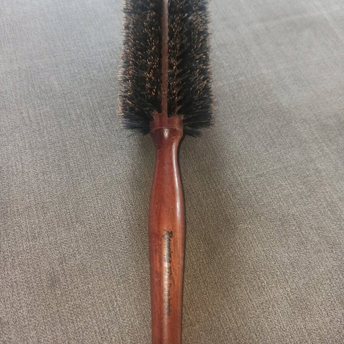 Round styling brush used, natural bristles