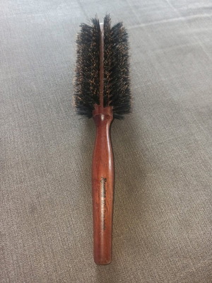 Round styling brush used, natural bristles