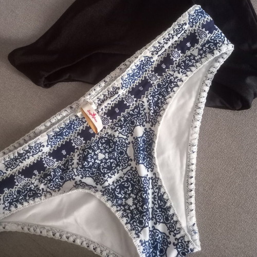Sugarfree swim brief with white-blue ethnic pattern, size Large, plus free black swim brief