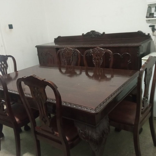Antique dining table with 6 Lion chairs used, moderate condition