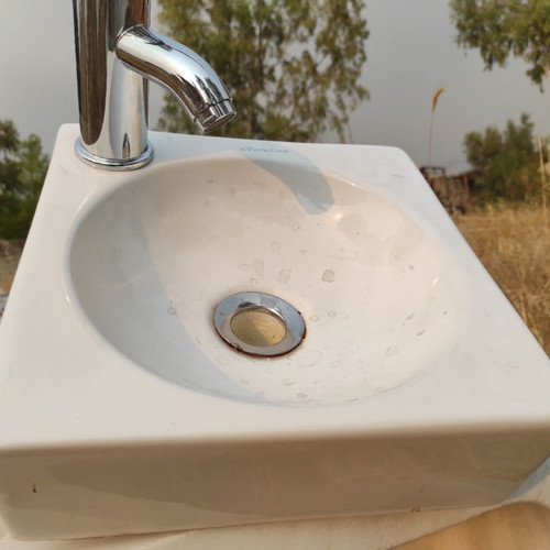 Sink with faucet and valve used