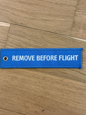 Remove Before Flight μπρελόκ σε γαλάζιο χρώμα, σαν καινούργιο