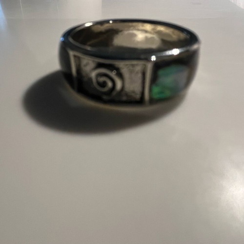 Steel ring with inlaid abalone shell details