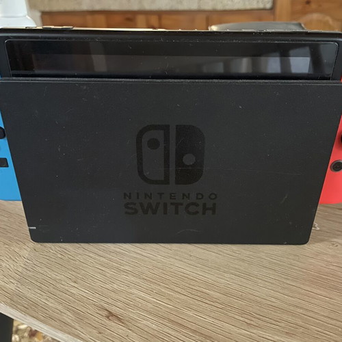 Nintendo Switch console with dock and original Joy-Con