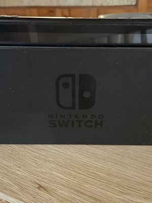 Nintendo Switch console with dock and original Joy-Con
