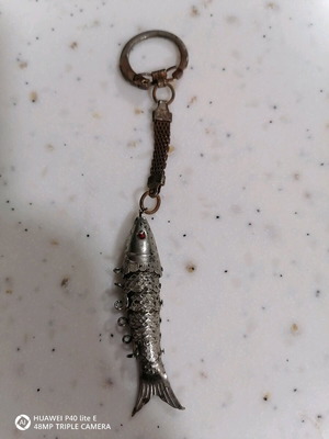 Fish keychain used, A.P.C., from 2000 with rust on the ring