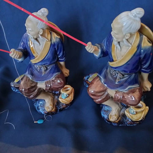 Decorative porcelain figurines used, two Chinese fishermen