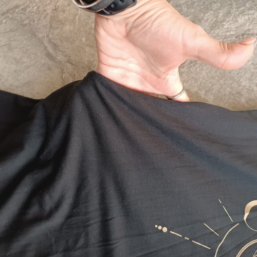 Black sleeveless dress like new with gold sun and moon print