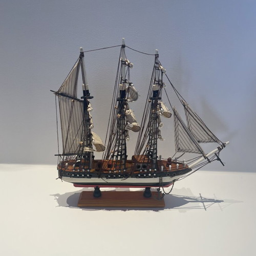 Vintage wooden decorative ship like new with striped sails and wooden base