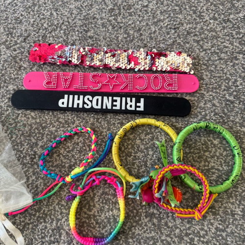 Children's jewelry used, colorful bracelets and pendants