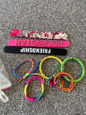 Children's jewelry used, colorful bracelets and pendants