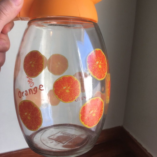 Solmazer jug like new with orange pattern and plastic lid