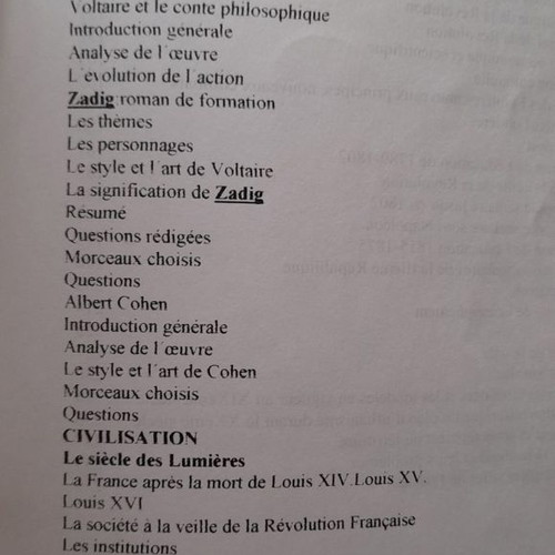 French language learning books used with handwritten notes