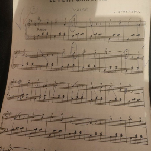 Piano music learning book used with melodic exercises and song sheet music