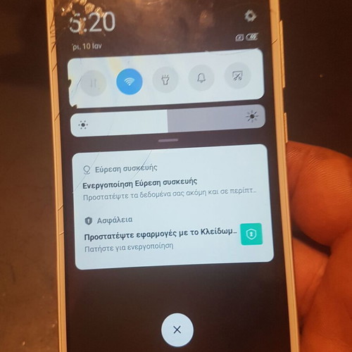 Xiaomi Redmi 4X smartphone with cracked screen, gold