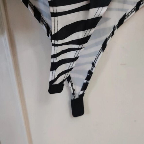 Long-sleeve zebra print bodysuit with V-neck and knot, like new
